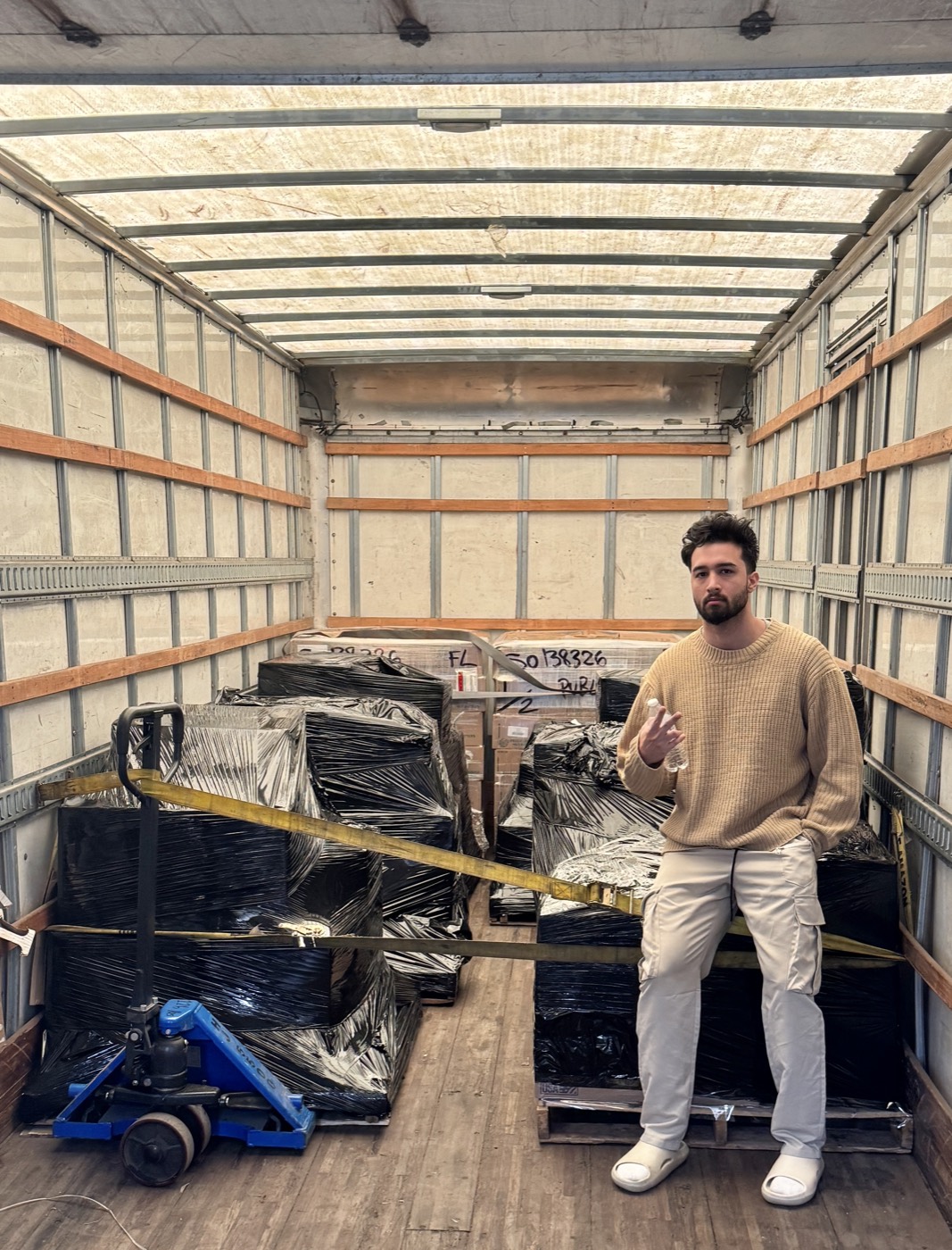 Nick Guerrero with a truck of palletized inventory